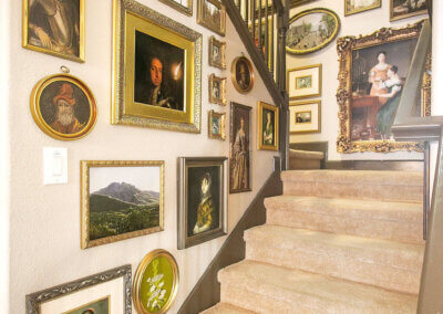 Staircase with walls covered in portrait art