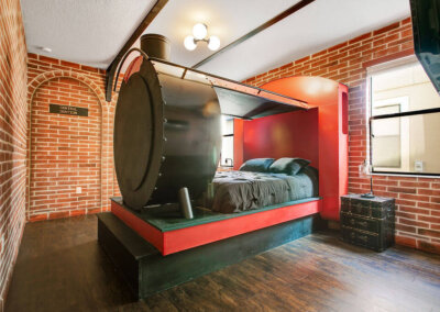 Wizards Way red and black brick central station room with a large train bed
