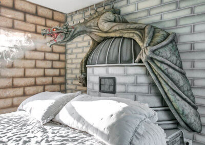 Grey Dragon statue with glowing red eyes breathing smoke over queen bed